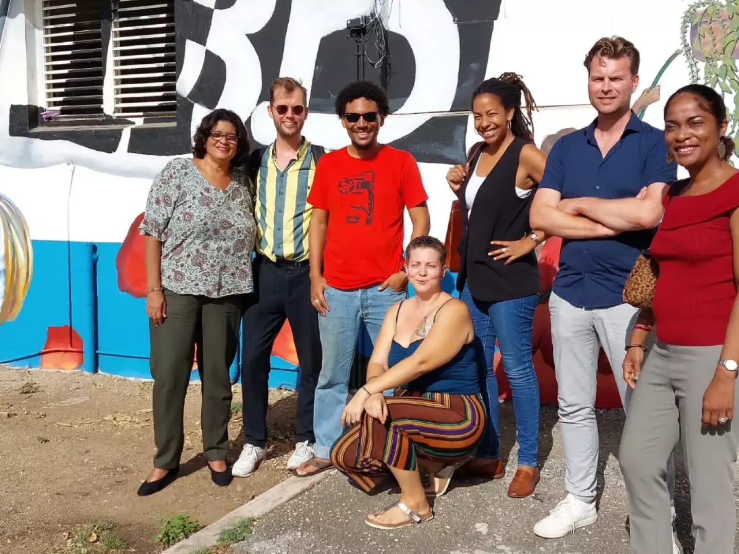 group of people standing outside art space Instituto Buena Bista in Curaçao